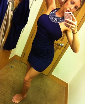 18 year old girl Katie Lewis stands naked after undressing in her bedroom